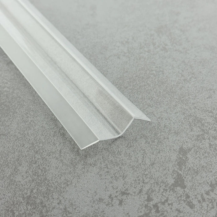 High-resolution detail of the S312DTL7 crystal-clear fins, showcasing their flexibility which allows the seal to conform around bottom rollers or clips where standard U-channel seals may not fit.