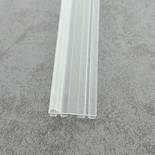 DOU02 clear vertical folding shower door seal showing the twin frame channels and flexible centre section
