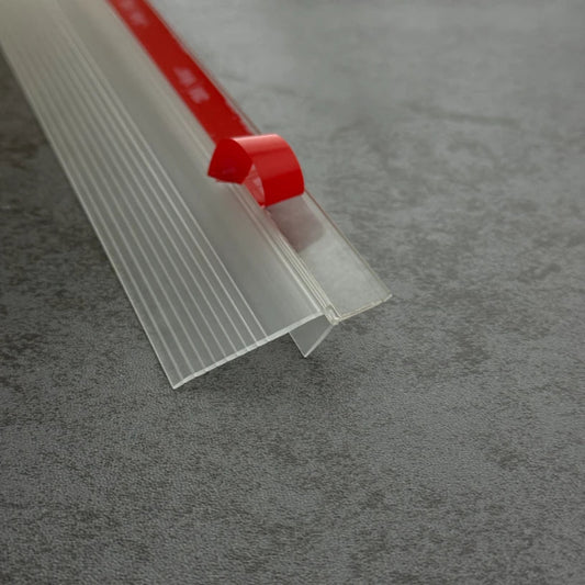 Close-up photogragh of S312S1235 high-temperature TPE seal profile, highlighting the pre-applied high-bond adhesive tape and flexible 35mm fin.