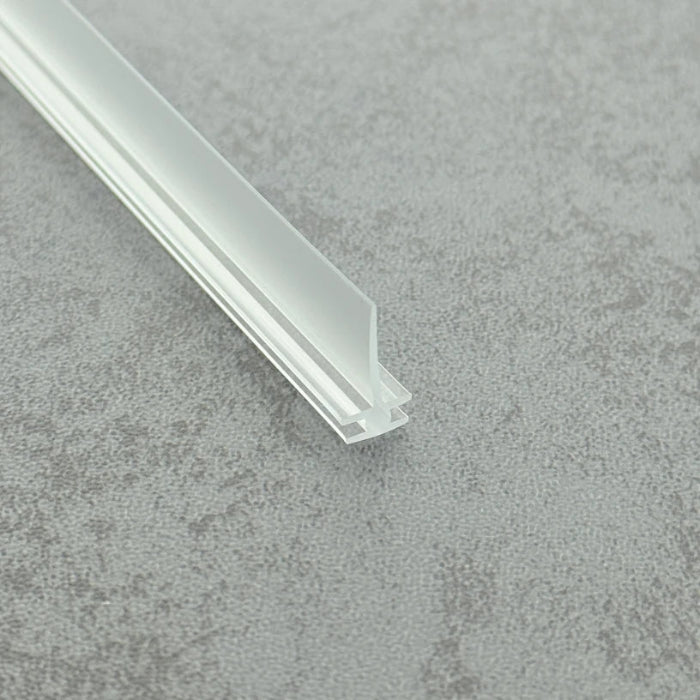 Angled view of the VI005 flexible bi-fold framed shower door seal with a compact 15mm fin