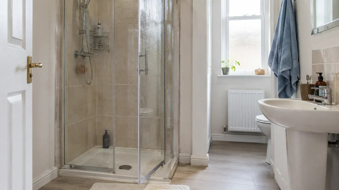 Glass shower door left open after a shower to help moisture clear