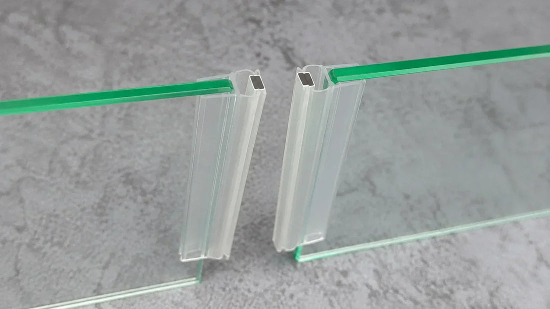 Close-up of two magnetic shower door seals separated by a gap and not sealing properly