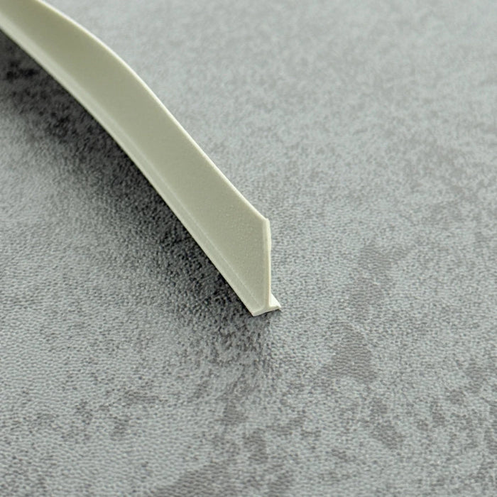 Micro-view of a framed shower door bottom seal strip replacement, showing how the 4mm white T-head locks securely within wider grooves while the 16mm long soft fin effectively conforms to the floor, providing a tight and colour-coordinated waterproof barrier at the base of white framed screens.