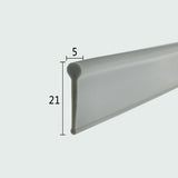 Cross-section close-up of the VF004 folding shower screen seal bottom, showcasing the dark grey soft PVC with a unique 5mm solid cylinder top and 21mm overall height, optimized for sealing the base of framed or folding shower doors to allow flexible movement.