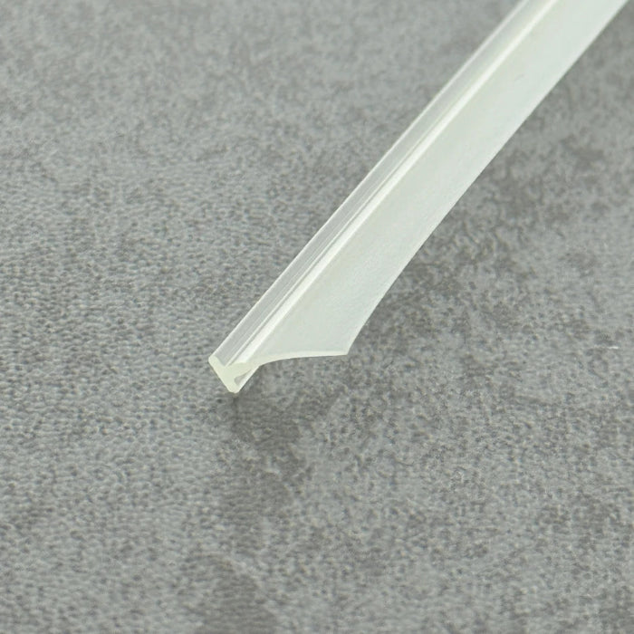 Micro-view of a framed shower door bottom seal, showing how the 6mm T-head achieves a tight interference fit within extra-wide grooves to prevent loosening from door vibration, while the 11mm long soft fin makes moderate contact with the floor, providing a lasting waterproof barrier at the base of heavy framed doors.