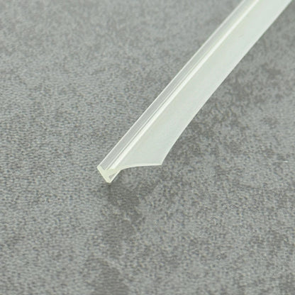 Micro-view of a framed shower door bottom seal, showing how the 6mm T-head achieves a tight interference fit within extra-wide grooves to prevent loosening from door vibration, while the 11mm long soft fin makes moderate contact with the floor, providing a lasting waterproof barrier at the base of heavy framed doors.