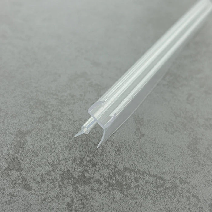 High-clarity close-up of a bath shower door bottom seal, showcasing the smooth finish and anti-UV material of the VD810, highlighting the elastic structure of the central bulb to ensure clear invisibility and a tight water fit in shower enclosures over baths.