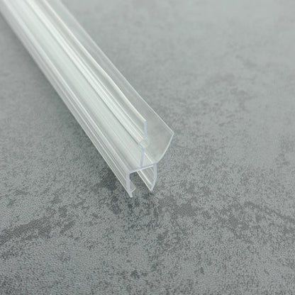 Micro-view of a bath shower screen bottom seal, showing reinforced U-channel walls, internal side rails, and how the unique central bulb on the 17mm fin increases contact pressure, providing a firmer grip for 8-10mm glass.