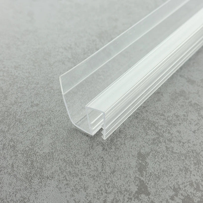 Macro close-up of the S810DTL reinforced profile, showcasing its extra-thick channel walls designed for high-load stability on 8-10mm glass, finished with a premium high-gloss transparent surface.