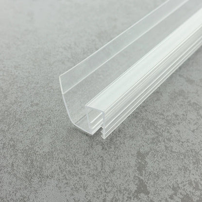Macro close-up of the S810DTL reinforced profile, showcasing its extra-thick channel walls designed for high-load stability on 8-10mm glass, finished with a premium high-gloss transparent surface.