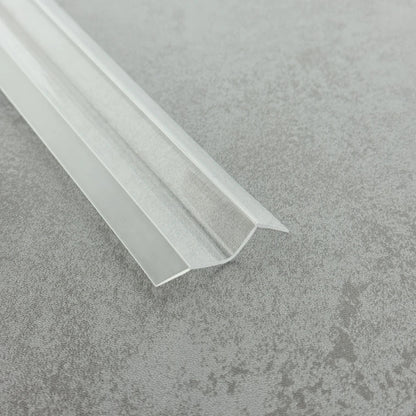 High-resolution detail of the S312DTL7 crystal-clear fins, showcasing their flexibility which allows the seal to conform around bottom rollers or clips where standard U-channel seals may not fit.