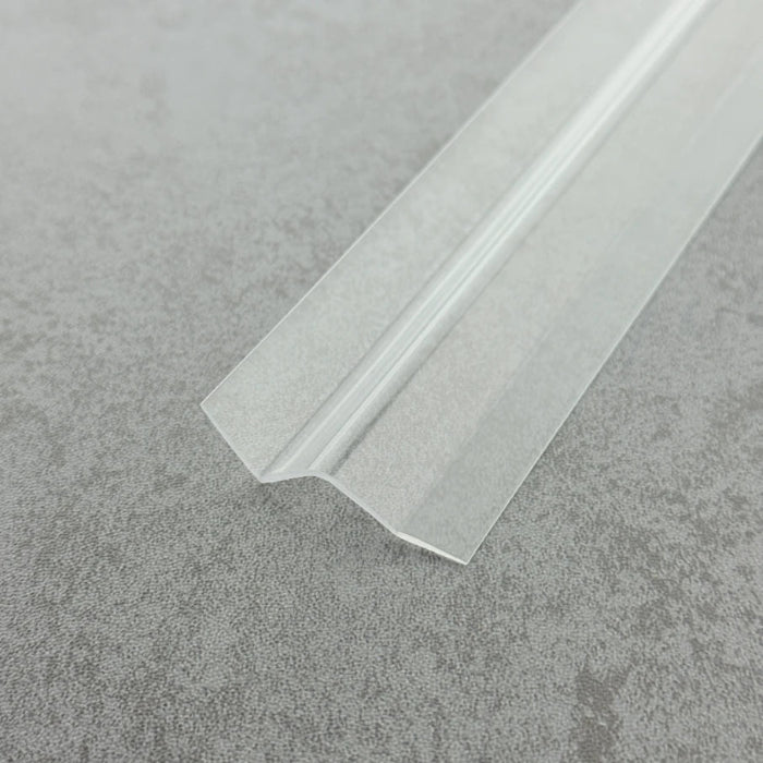 Macro close-up of the S312DTL7 transparent body, highlighting the smooth high-gloss finish and the secure bond between the PVC layer and the adhesive substrate, suitable for wet bathroom environments.