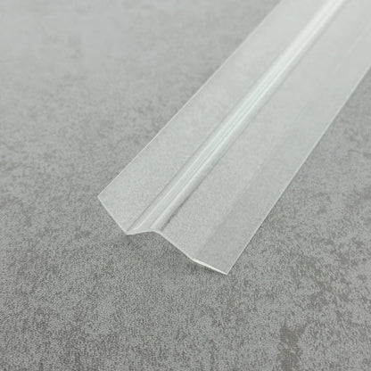 Macro close-up of the S312DTL7 transparent body, highlighting the smooth high-gloss finish and the secure bond between the PVC layer and the adhesive substrate, suitable for wet bathroom environments.