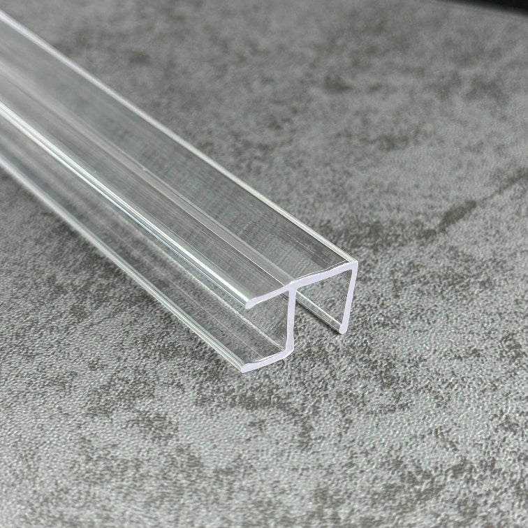 Close-up of the C410A90 clear rigid PVC corner seal showing the two U-shaped glass channels
