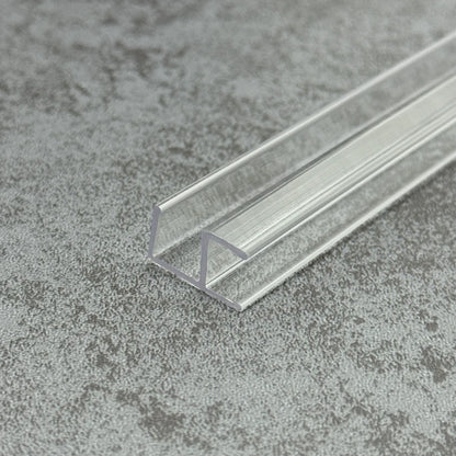 Angled view of the C410A90 clear shower screen corner seal for fixed glass panels