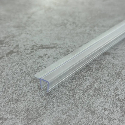 Close-up of the clear PVC F456S8 F shape shower door seal with short flexible fin