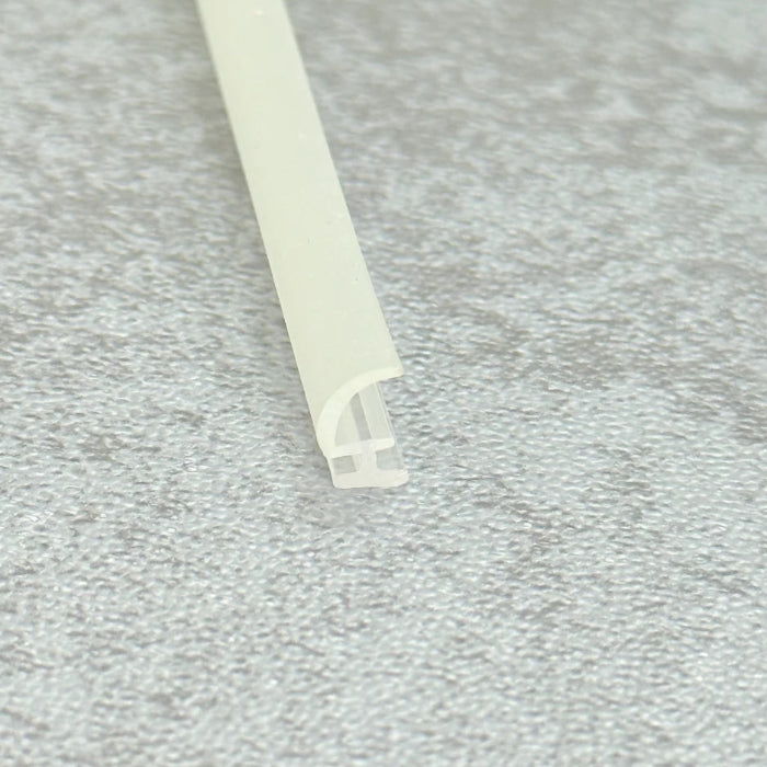 Low-profile 7mm hook-shaped water deflector for restricted clearance shower tracks