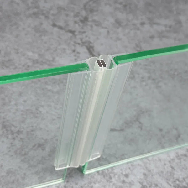 M10B2M magnetic seal pair fitted where two 10mm sliding shower door glass panels meet in a straight 180-degree closure