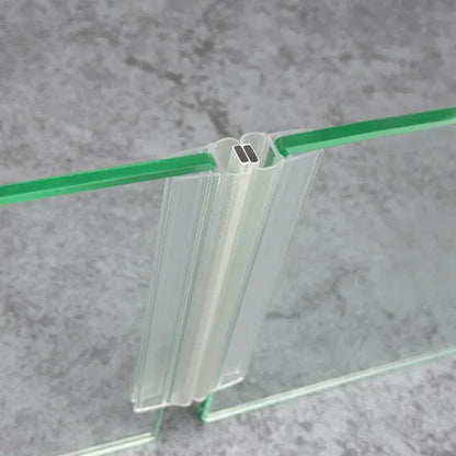 M45B2M magnetic seal pair fitted where two sliding shower door glass panels meet in a straight 180-degree closure