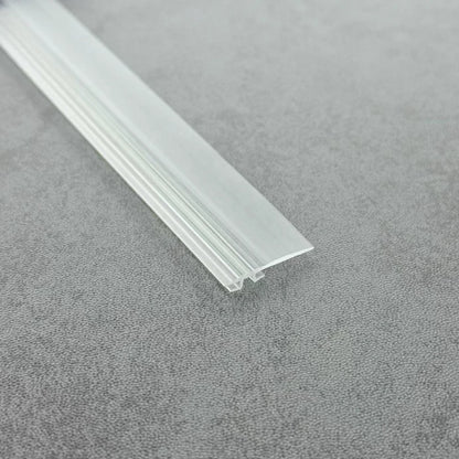 Close-up of the clear PVC ROT03 folding shower door track insert seal