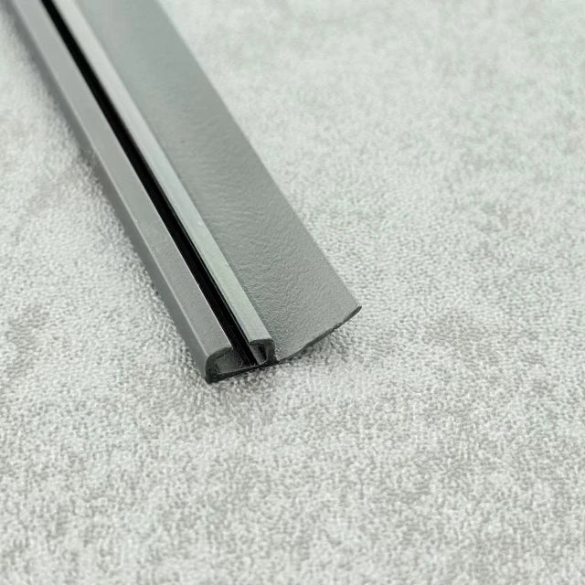 Close-up of the black PVC ROT04 folding shower door channel seal profile