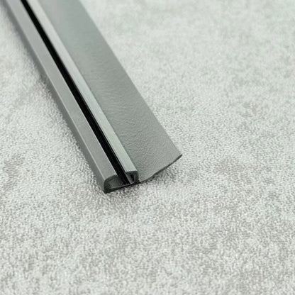 Close-up of the black PVC ROT04 folding shower door channel seal profile