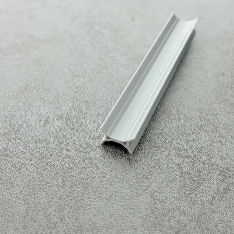 Close-up of the dark grey PVC ROT08 folding shower door side buffer seal