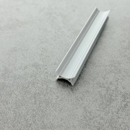 Close-up of the dark grey PVC ROT08 folding shower door side buffer seal