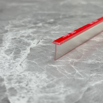 Angled view of the RY3463 T-slot seal profile for compatible framed shower door channels