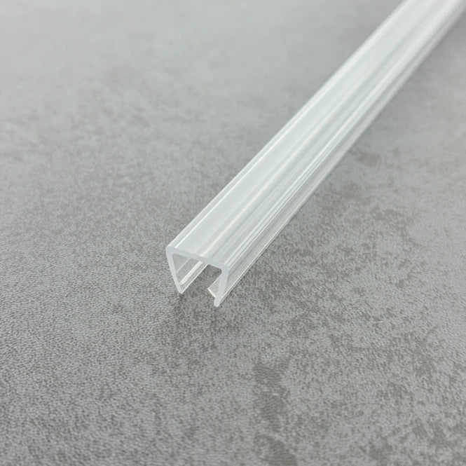 Close-up macro shot of the UH810 transparent PVC edge trim, highlighting its robust structure and anti-shatter properties designed specifically for heavy 8-10mm glass enclosures.