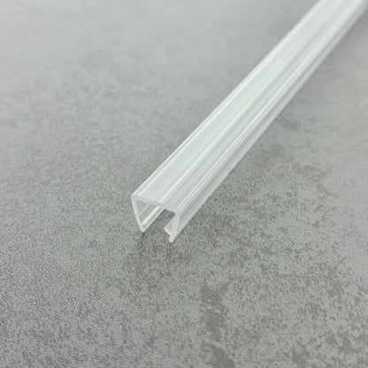 Close-up macro shot of the UH810 transparent PVC edge trim, highlighting its robust structure and anti-shatter properties designed specifically for heavy 8-10mm glass enclosures.