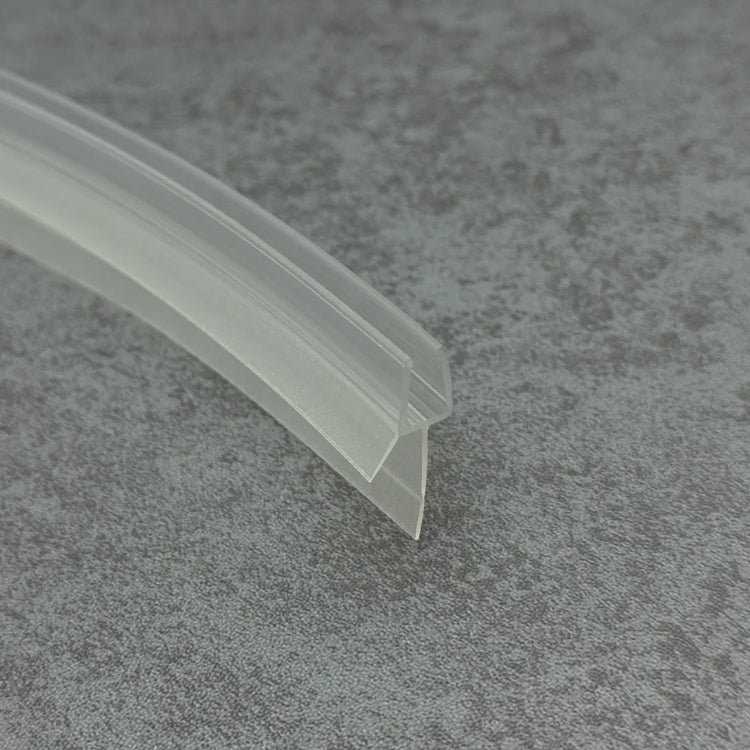 Close-up of the clear PVC V456S8CU curved shower door bottom seal with short flexible fin