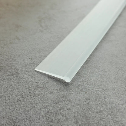 Close-up of the clear flexible PVC VF002 round bead bottom seal profile