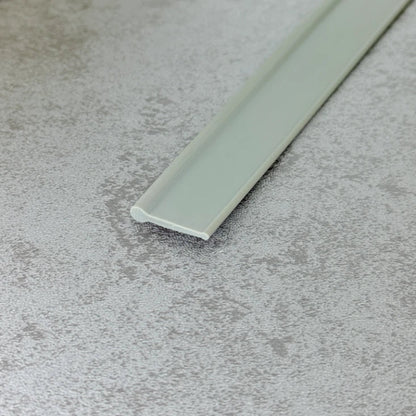 Close-up of the dark grey flexible PVC VF004 round bead bottom seal profile