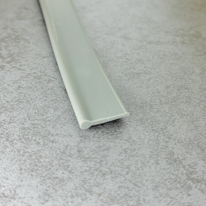 Angled view of the VF004 dark grey bottom seal for framed and folding shower doors