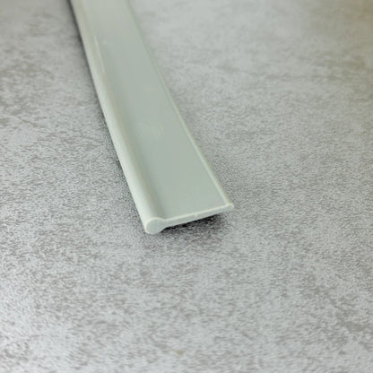 Angled view of the VF004 dark grey bottom seal for framed and folding shower doors