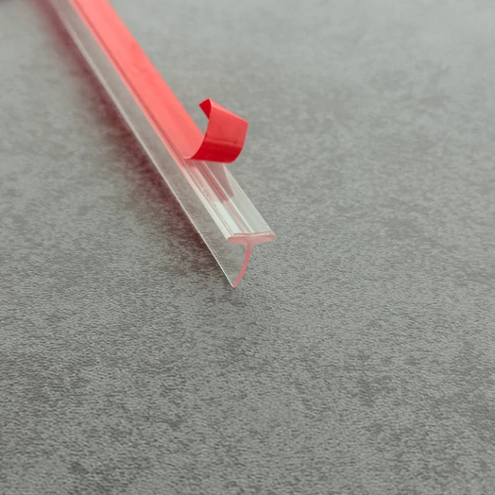 Angled view of the VH009 10mm T-slot seal for compatible framed shower door channels