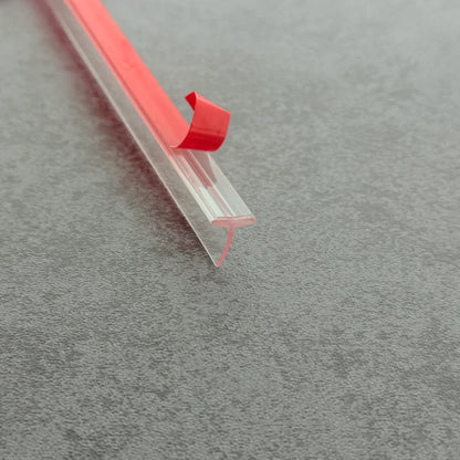 Angled view of the VH009 10mm T-slot seal for compatible framed shower door channels