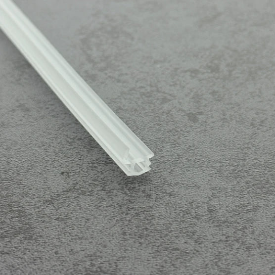 Close-up of the clear PVC VL005 shower door channel bumper strip for framed doors