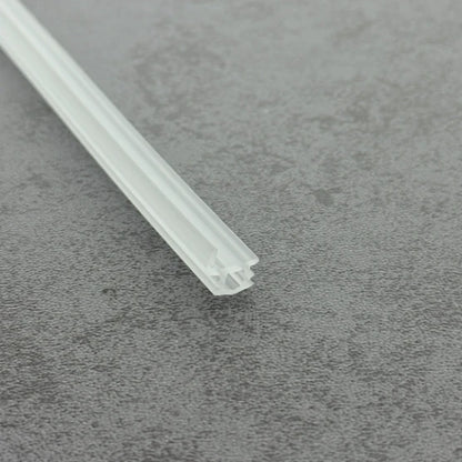 Close-up of the clear PVC VL005 shower door channel bumper strip for framed doors